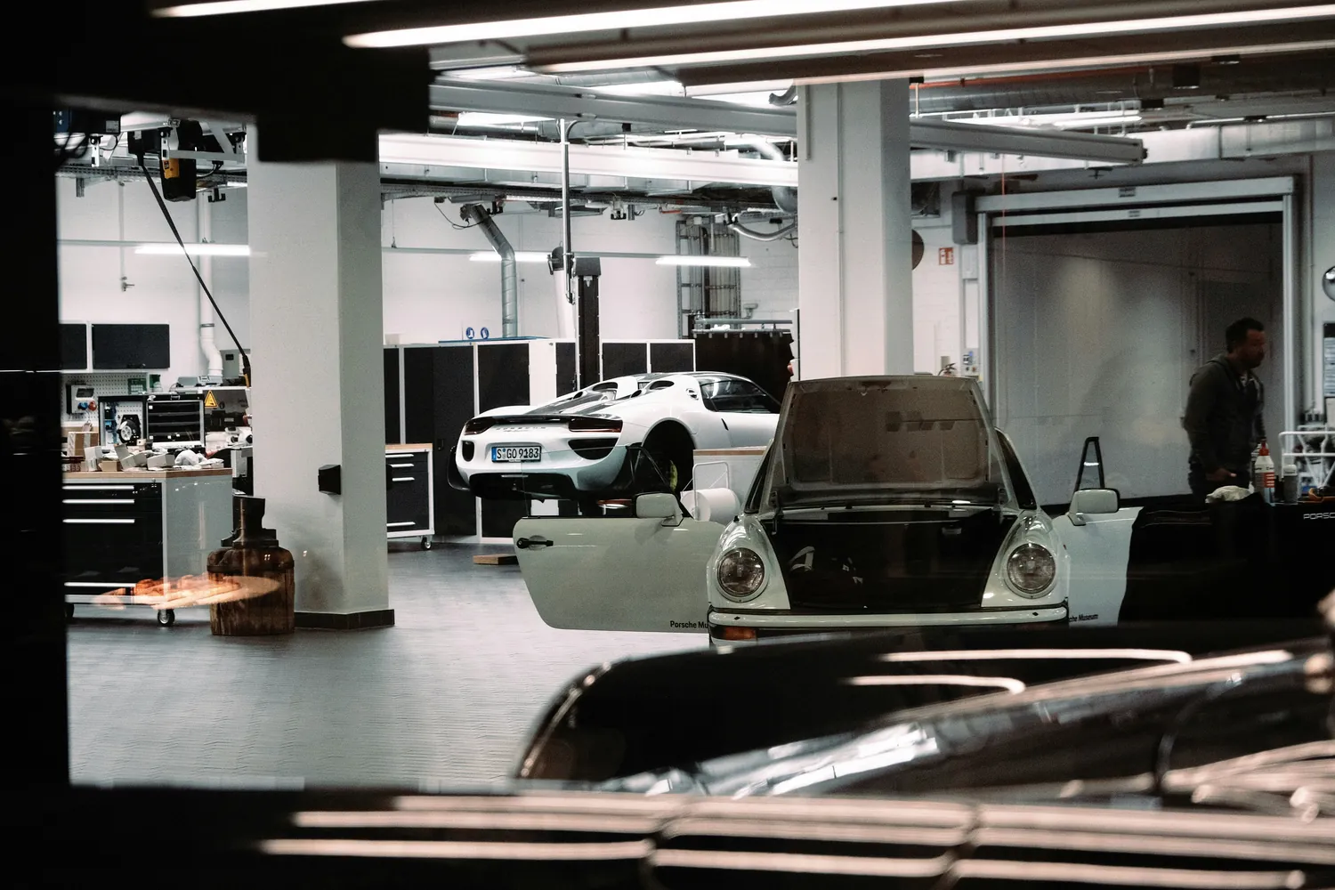 Automotive workshop with multiple cars and service equipment